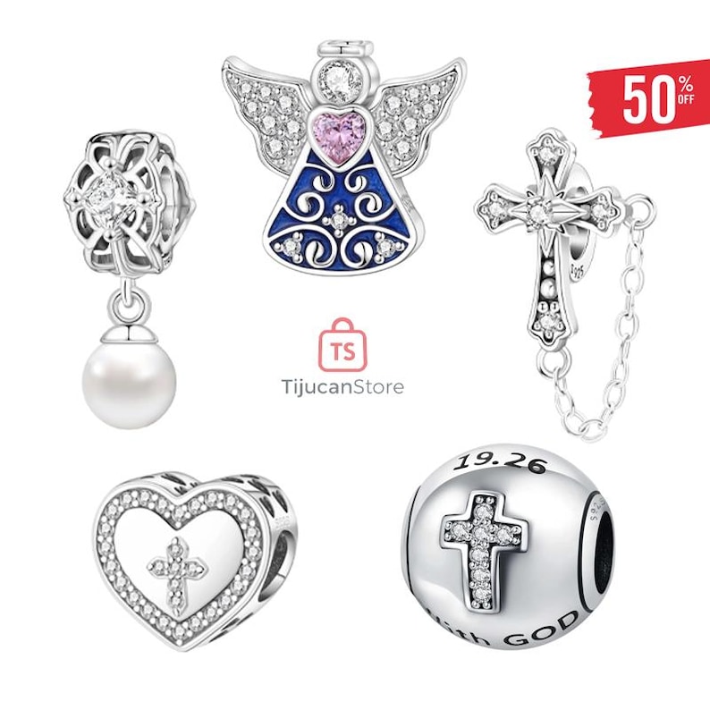 May include: A collection of silver-toned charm beads. The charms include an angel with a pink heart, a cross, a heart with a cross, a bead with a cross and the text "WITH GOD", and a floral bead with a pearl.