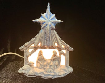 Small ceramic nativity with star