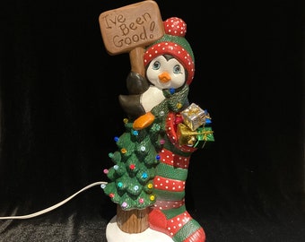 Ceramic penguin with stocking