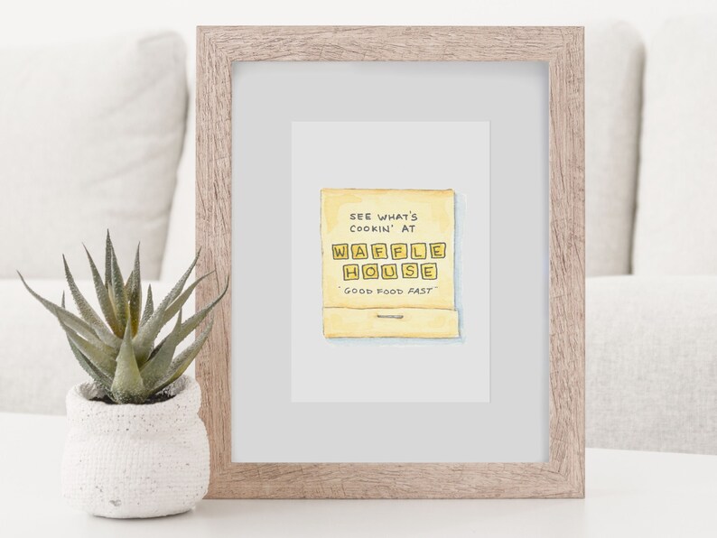 K&ouml;nnte beinhalten: Eine Aquarellillustration eines gelben Streichholzschachtels mit dem Text "See what's cookin' at Waffle House. Good food fast."