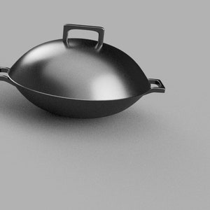 May include: A black cast iron wok with two handles and a lid. The wok is sitting on a grey surface.