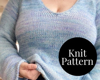 May include: A blue and purple knit sweater with a V-neck and long sleeves. The sweater has a loose fit and is made with a soft yarn. The text "Knit Pattern" is visible on a black circle.