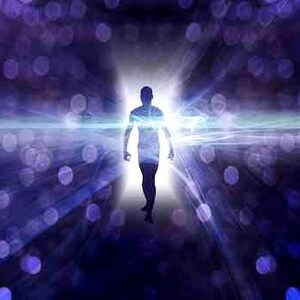 May include: A silhouette of a person walking towards a bright light in a dark, blurry background with purple and blue bokeh lights.