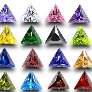 May include: Assortment of 16 triangular shaped gemstones in various colours, including purple, white, pink, green, yellow, blue, red, and brown.