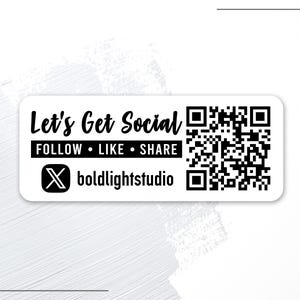 May include: A white rectangular sticker with the text "Let's Get Social" in a bold, black font. Below, it says "FOLLOW • LIKE • SHARE" in a smaller, black font. A QR code and the boldlightstudio logo are also present.