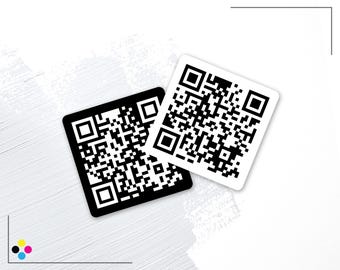 May include: Two square stickers featuring black and white QR codes. One sticker has a black background with white code patterns, while the other has a white background with black code patterns. Both stickers have rounded corners and a flat, matte finish.