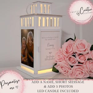 Op de afbeelding: Witte lantaarn met een fotolijst en een gepersonaliseerd bericht dat luidt "We're as lucky as can be The world's best Nanny Belongs to us. Lots of love from Bella & Freddie". De lantaarn wordt geleverd met een LED-kaars.