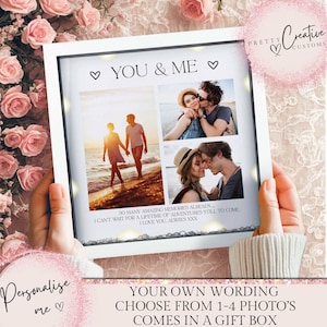 May include: A white framed photo display with four images of couples. The text "YOU & ME" and "SO MANY AMAZING MEMORIES ALREADY... I CAN'T WAIT FOR A LIFETIME OF ADVENTURES STILL, TO COME I LOVE YOU, ALWAYS XXX" are visible. The display is held by a person.