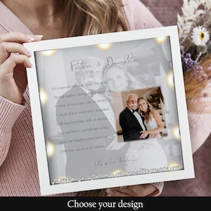 May include: A white frame with a black and white photo of a father and daughter. The frame has a light grey background with a poem about the special bond between a father and daughter. The poem reads: "It's a special bond that spans the years Through laughter, worry, smiles and tears A sense of trust that can't be broken A depth of love sometimes unspoken A long friendship built on sharing Hugs and kisses, warmth and caring Father and Daughter their hearts are one A link that can never be undone"
