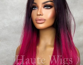May include: A long, straight, ombre wig with dark roots that fade to pink. The wig is styled with a center part and falls to the shoulders.