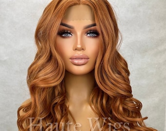 May include: A long, wavy, auburn-colored wig with a lace front. The wig is styled in loose waves and falls to the shoulders.