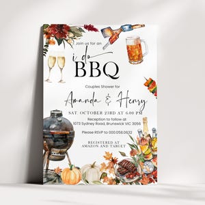 May include: A white invitation card for an I Do BBQ couples shower for Amanda and Henry on Saturday, October 23rd at 6:00 PM. The design features watercolor illustrations of a grill, beer, champagne, food, and autumn leaves with event details.