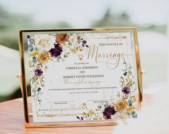 May include: A marriage certificate with a floral design featuring burgundy, yellow, and white flowers. The text reads "Certificate of Marriage" and "This certifies that Cordelia Anderson and Robert Pater Wilkinson were united in marriage in confirmation and celebration of their commitment they set their hands below 05/09/2024 in Hilton, Colorado. Officiated by Lorem Ipsum Church."