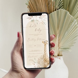 Peut inclure: Une invitation num&eacute;rique pour une baby shower avec une illustration aquarelle d'une girafe et des accents floraux. L'invitation indique "hello baby" et comprend le nom "Bretting Paterson", la date "24 ao&ucirc;t", l'heure "13h00" et le lieu "1073 Sidney ERZS&Eacute;BET KAT. 9-11".