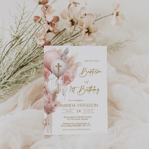 May include: A baptism and first birthday invitation with a watercolor illustration of pink and white balloons, pampas grass, and a cross. The text reads "Join us for a Baptism and 1st Birthday of our daughter Amanda Paterson August 24 at 3:00 PM Resurrection Catholic Church 157 Pitt Street, Sydney Followed by a celebration at 1073 sidney ERZS&Eacute;BET KRT. 9-11. RSVP to OUMA at 000.000.0000"