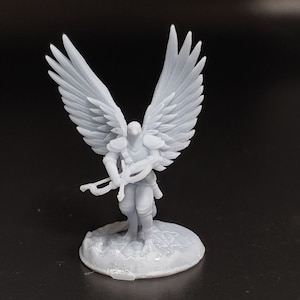 May include: A white 3D printed miniature of a winged humanoid figure holding a bow and arrow. The figure is wearing armor and has a bird-like head.