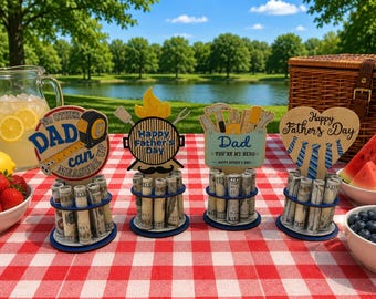 May include: Four wooden Father's Day money holders with circular bases. The first features a tape measure and text "No other DAD can measure up". The second shows a grill and flame. The third displays tools and "Dad you're my hero". The fourth is heart-shaped.
