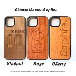 May include: Three phone cases made of different types of wood: walnut, rose, and cherry. Each case has a different design engraved on the wood. The walnut case has the text "YOUR NAME" and the number "10" engraved on it. The rose case has the letters "EG" engraved on it. The cherry case has the name "Sophie" engraved on it.
