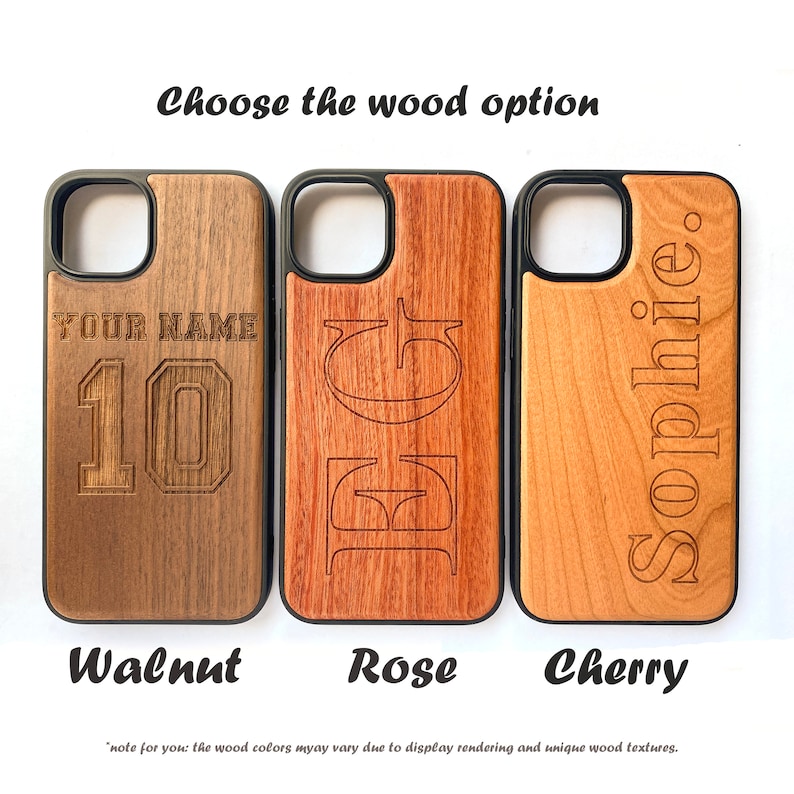 May include: Three phone cases made of different types of wood: walnut, rose, and cherry. Each case has a different design engraved on the wood. The walnut case has the text "YOUR NAME" and the number "10" engraved on it. The rose case has the letters "EG" engraved on it. The cherry case has the name "Sophie" engraved on it.