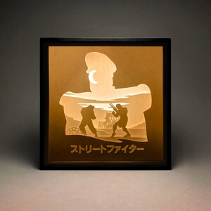 Street Fighter Paper Cut LightBox, Shadow Box, SVG, modelo de corte de papel 3D, Cricut, decoração de parede, sala de jogos, Ryu, Vega, Arcade, para amantes dos anos 80