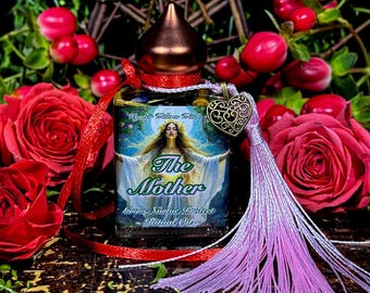 May include: A glass bottle with a copper top and a pink tassel. The bottle is labeled "The Mother" and "Sacred Mystic Protect Ritual Oil". The bottle is surrounded by red roses and green foliage.