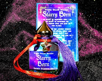 May include: A small glass bottle with a purple tassel and a red ribbon. The bottle is filled with a clear liquid and has a star-shaped charm hanging from the neck. The label on the bottle reads "Winter Willow Witchery Starry Born Sacred Starseed Oil".