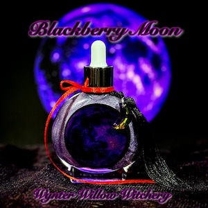May include: A round, purple glass bottle with a dropper, red ribbon, and black tassel. The bottle has a dark purple liquid inside and the words "Blackberry Moon" and "Wynter Willow Witchery" are written on the image. A purple orb is in the background.