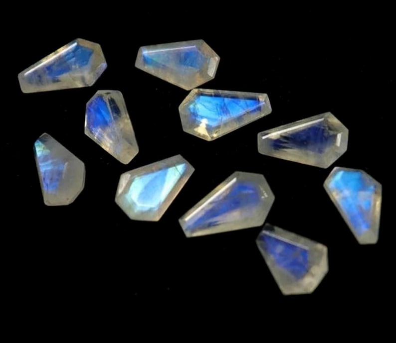 10 AAA vita regnbågsmånstenar, kistslipade 13 x 8 mm bild 1