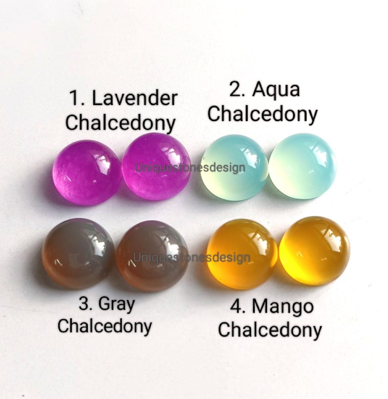 May include: Four pairs of round, polished chalcedony cabochons in lavender, aqua, gray, and mango colors. Each pair is labeled with the color name and "Chalcedony".