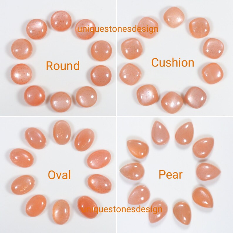 May include: A collection of sunstone cabochons in various shapes, including round, cushion, oval, and pear. The stones are a light peach colour with a shimmery, iridescent finish.