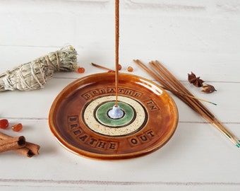 Brown round ceramic incense holder with inscription Textured incense burner for meditation