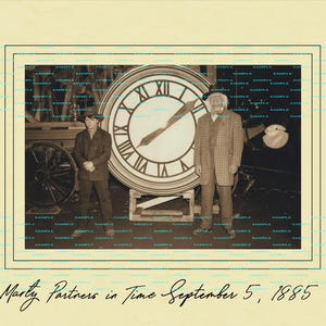 May include: A black and white photo of a clock tower with the text "To Marty Partners in Time September 5, 1885". Two people are standing in front of the clock tower.