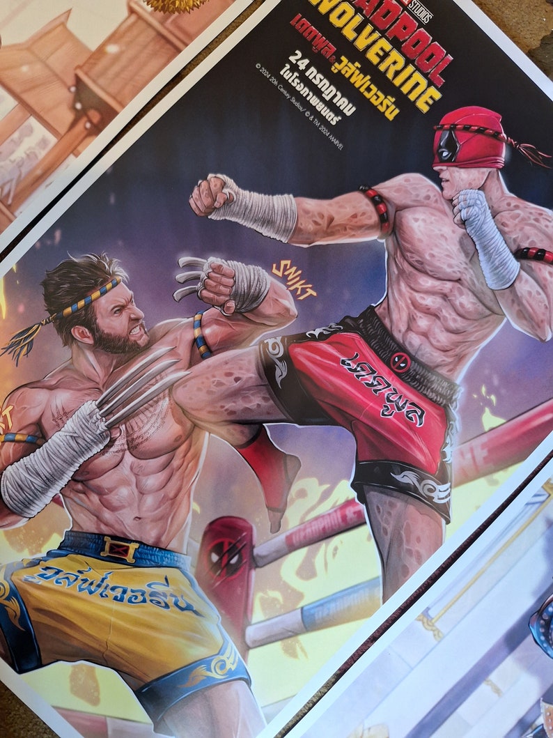 May include: A poster for the movie Deadpool vs. Wolverine. The poster features Deadpool and Wolverine in a Muay Thai fighting stance. The poster is in a red, yellow, and blue color scheme. The text on the poster reads "Deadpool vs. Wolverine" and "24 กรกฎาคม ในโรงภาพยนตร์".