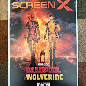 May include: Movie poster for the film "Deadpool & Wolverine" featuring Deadpool and Wolverine standing in front of a fiery background. The poster also includes the text "See More In ScreenX" and "Marvel Studios".