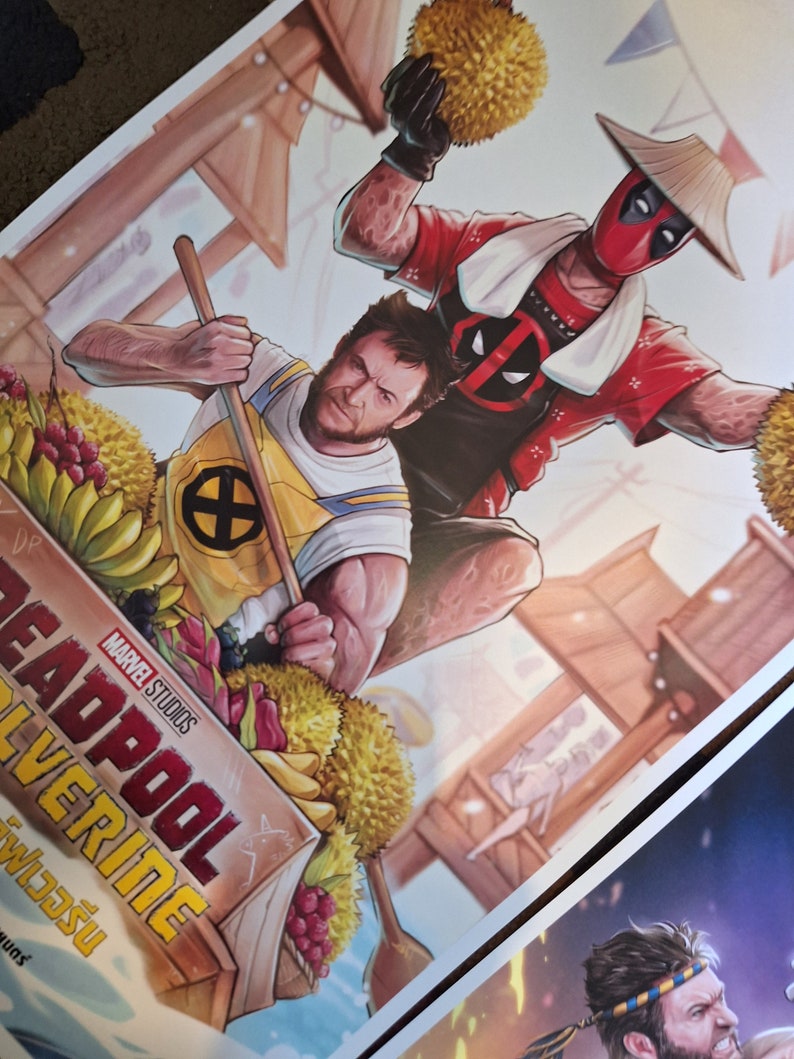 May include: A colorful illustration of Deadpool and Wolverine in a boat filled with fruit. Deadpool is wearing a red and white suit with a traditional Asian hat and a white towel around his neck. Wolverine is wearing a yellow and blue shirt with the X-Men logo. The text "Deadpool Wolverine" is written in red and white letters on the side of the boat.