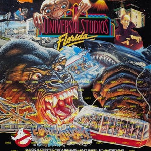 May include: A vintage Universal Studios Florida theme park poster. The poster features King Kong, E.T., a shark, and a Back to the Future DeLorean. The poster also includes the text "See the Stars. Ride the Movies."