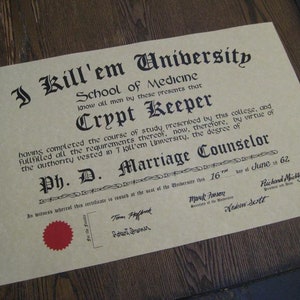 May include: A humorous diploma certificate with a vintage design, featuring the text "I Kill'em University School of Medicine" and "Crypt Keeper Ph. D. Marriage Counselor".