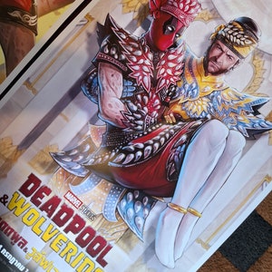 May include: A poster featuring Deadpool and Wolverine in traditional Thai clothing. The poster is titled "Deadpool & Wolverine" with the text "MARVEL STUDIOS" above the title. The text below the title is in Thai.