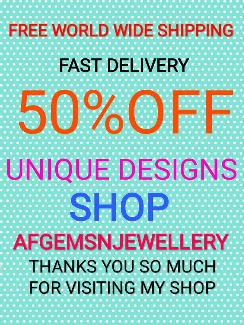 May include: A turquoise background with white polka dots features a sale announcement for unique designs. The text reads "FREE WORLD WIDE SHIPPING", "FAST DELIVERY", "50% OFF", "UNIQUE DESIGNS", "SHOP", "AFGEMSNJEWELLERY", "THANKS YOU SO MUCH", and "FOR VISITING MY SHOP".