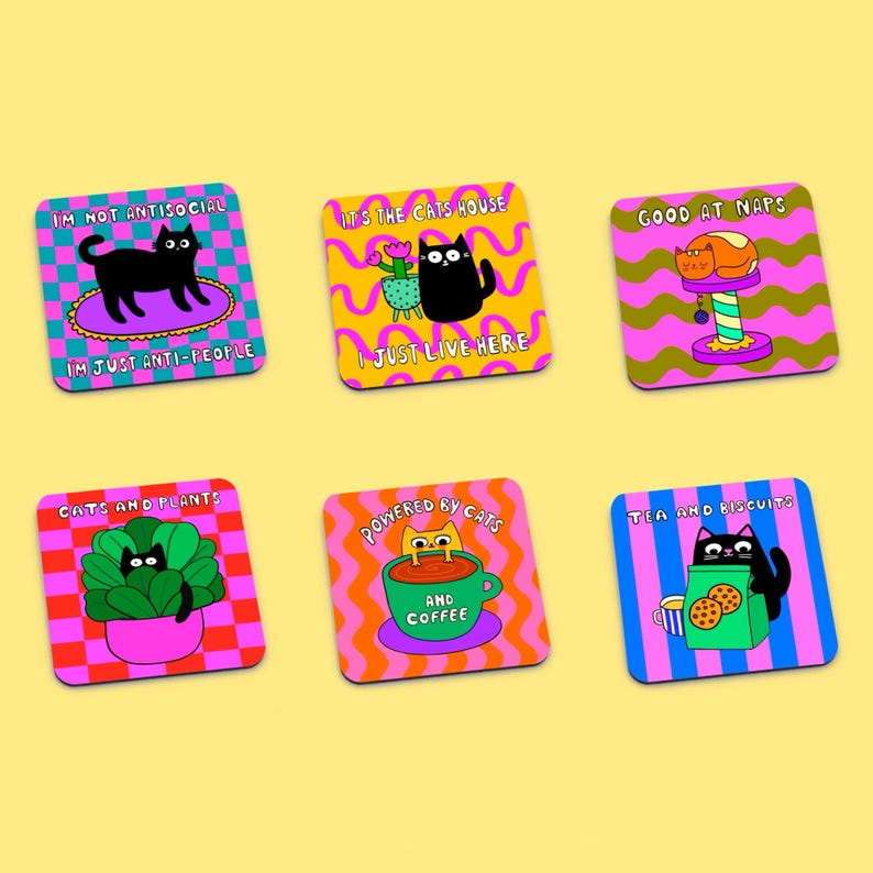 May include: Set of six colorful square coasters featuring black cats and humorous cat-themed sayings. The coasters have a variety of patterns, including checkered, wavy, and striped designs. The sayings on the coasters include "I'm not antisocial, I'm just anti-people", "It's the cats house, I just live here", "Good at naps", "Cats and plants", "Powered by cats and coffee", and "Tea and biscuits".