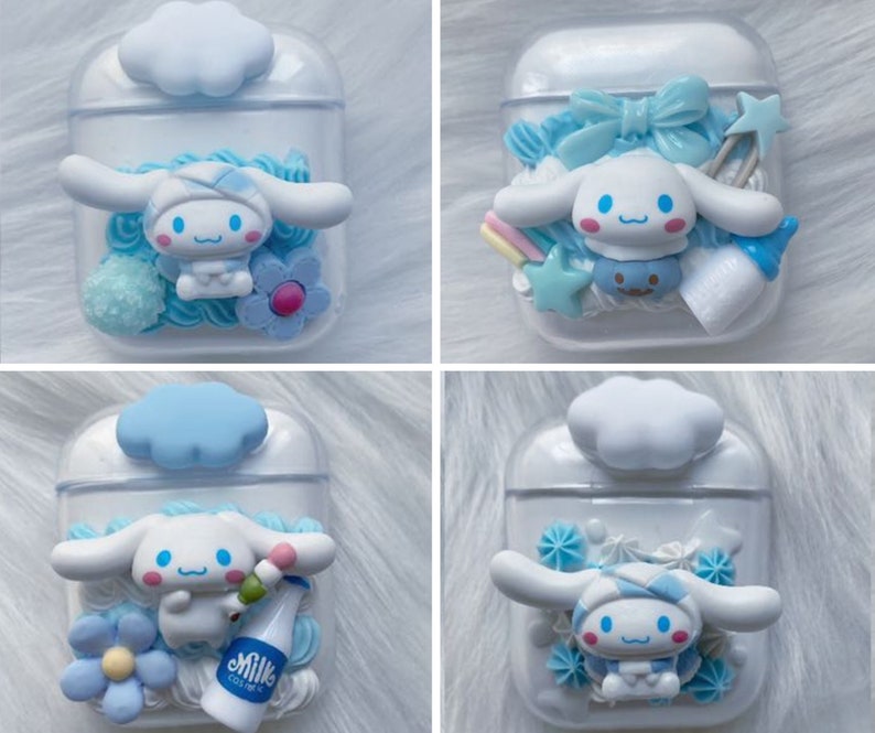 May include: Four different Airpod cases decorated with a white and blue character with a bow and a blue and white cloud on top. The cases are clear and show the decorations inside.