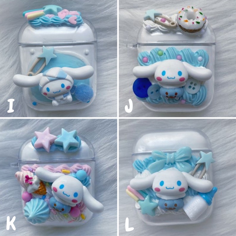 May include: Four clear plastic AirPod cases decorated with pastel blue, pink, and white 3D embellishments. Each case features a white cartoon dog with blue eyes and a pink nose. The embellishments include stars, bows, sprinkles, and a pacifier.