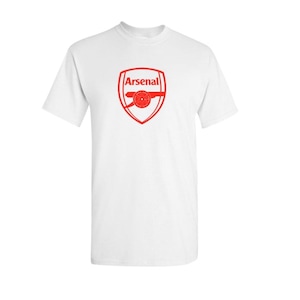 May include: White t-shirt with the red Arsenal logo. The logo features the word "Arsenal" above a cannon design inside a shield. The shirt has a crew neck and short sleeves.