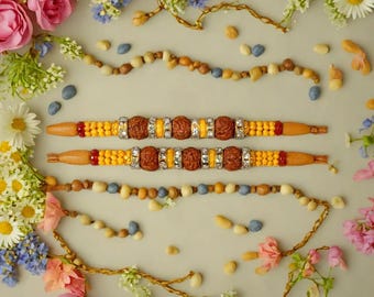 Rakhi Set of Two with 3 Rudraksh & 6 Daimond Rings with Multi Color Thread