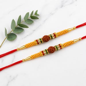 Rakhi for Brother Golden Rakhee with Stone for Bhaiya Rakhi, Raksha Bandha Gift for your brother Vary Color and Multi Design - Set of 2
