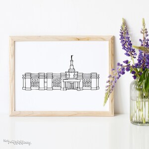 May include: A black and white line drawing of a building with a spire and a statue on top. The building has a symmetrical design with multiple windows and a large entrance.