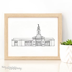 May include: A black and white line drawing of a temple with a tall spire and a statue on top. The temple has a large entrance with double doors and windows on either side. The drawing is framed in a light wood frame.