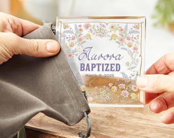 May include: A clear glass plaque with a floral border and the text "Aurora Baptized March 8, 2025".