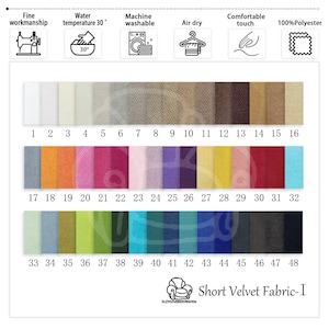 K&ouml;nnte beinhalten: Eine Farbkarte f&uuml;r Short Velvet Fabric-I mit 48 Farbfeldern in verschiedenen Farbt&ouml;nen. Die Karte enth&auml;lt Symbole f&uuml;r feine Verarbeitung, Maschinenwaschbarkeit, Lufttrocknung und 100 % Polyester. Die Farben reichen von Wei&szlig; bis Schwarz, mit lebendigen Farbt&ouml;nen von Rosa, Blau und Gr&uuml;n.