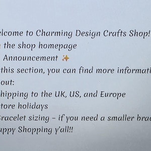 May include: White paper with black text. The text reads "Welcome to Charming Design Crafts Shop!" and announces information about shipping, store holidays, and bracelet sizing. The phrase "Happy Shopping y'all!!" is at the bottom.